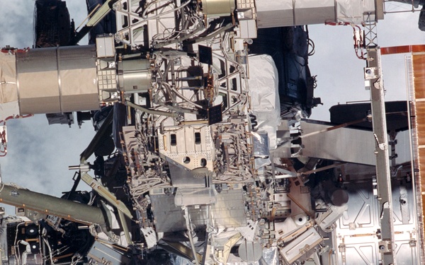 Exterior view of ISS during flyaround by STS-105 showing Node 1, P6 and Z1 trusses