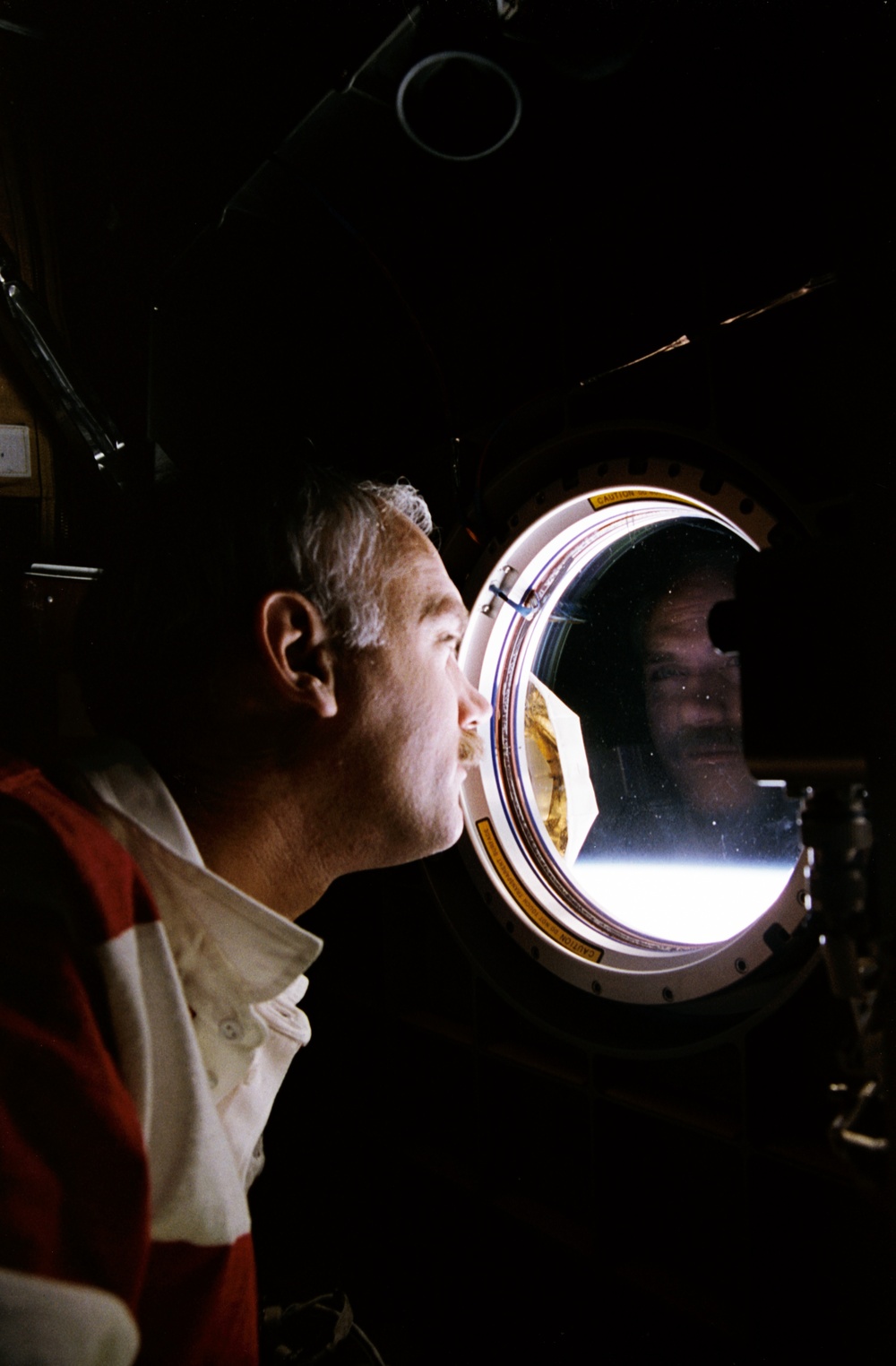 Astronauts Apt and Readdy at Spacehab window