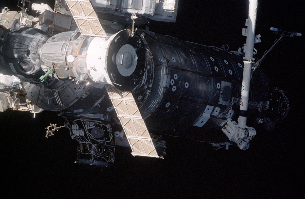 Exterior view of ISS during flyaround by STS-105 showing Soyuz and LAB