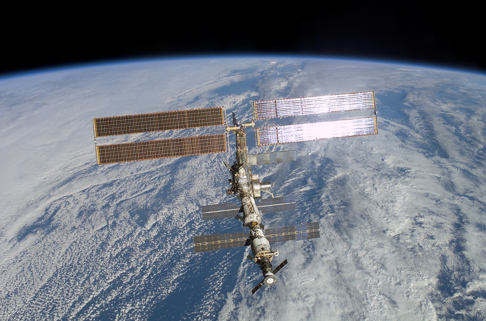 The aft - zenith side of the ISS taken during the STS-108 undocking and flyaround