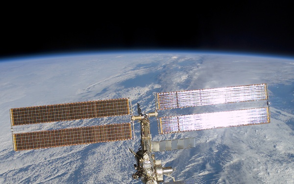 The aft - zenith side of the ISS taken during the STS-108 undocking and flyaround