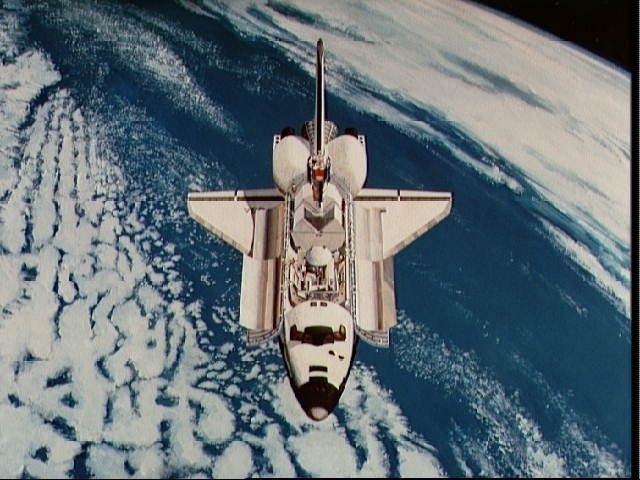 Rockwell art concept view of Shuttle in orbit with open cargo bay