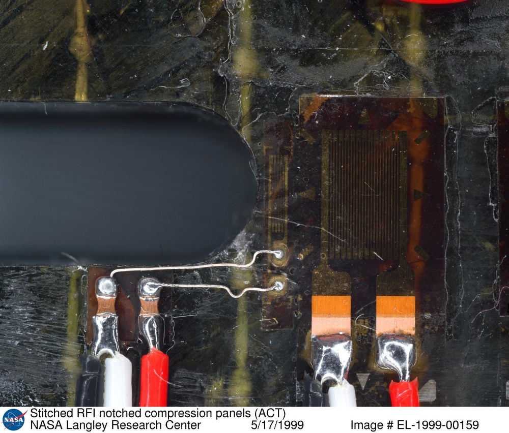 Stitched RFI notched compression panels (ACT)