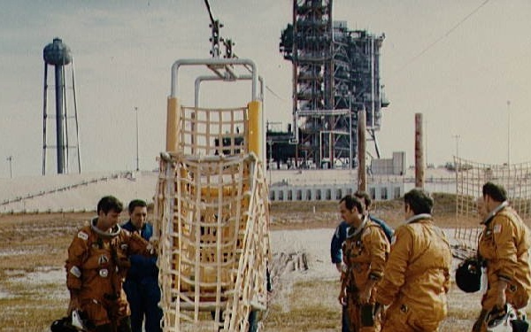 STS-1 crew and backups are briefed on KSC slide wire system by G.W.S. Abbey