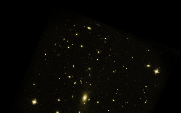 Host Galaxy Cluster to Largest Known Radio Eruption