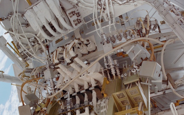 View of the aft avionics tray between the Z1 and S0 Trusses taken during the fourth EVA of STS-110