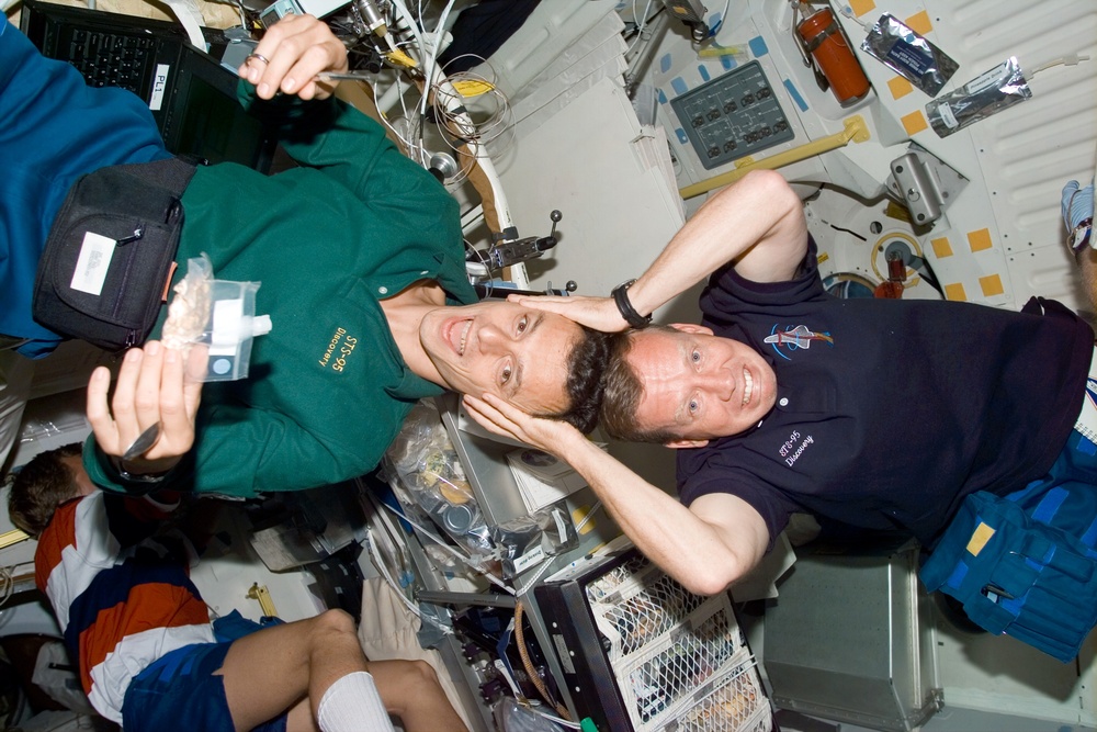 Candid views of Lindsey and Duque on the middeck