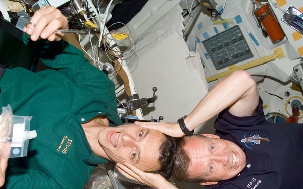 Candid views of Lindsey and Duque on the middeck