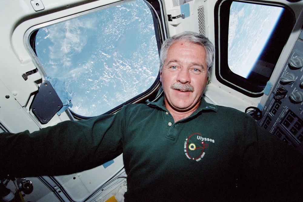 MS Phillips on the aft flight deck of Endeavour during STS-100