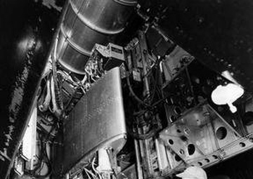 TG-180 ENGINE IN B-29 AIRPLANE IN PROCESS OF DISASSEMBLY