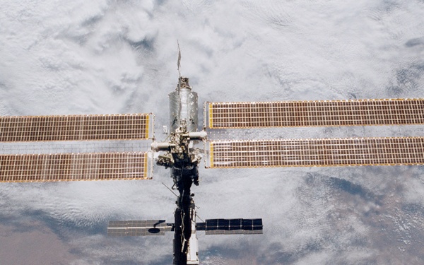 Various views of the ISS during flyaround backdropped by the Earth