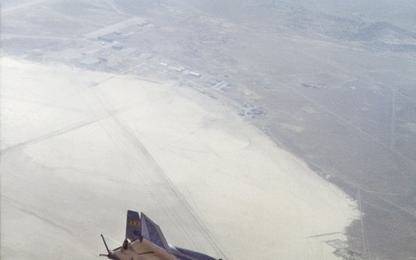 HL-10 in flight, turning to line up with lakebed runway 18