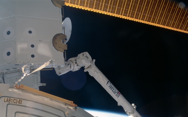 View of the SSRMS grappling the SLP during the STS-100 mission