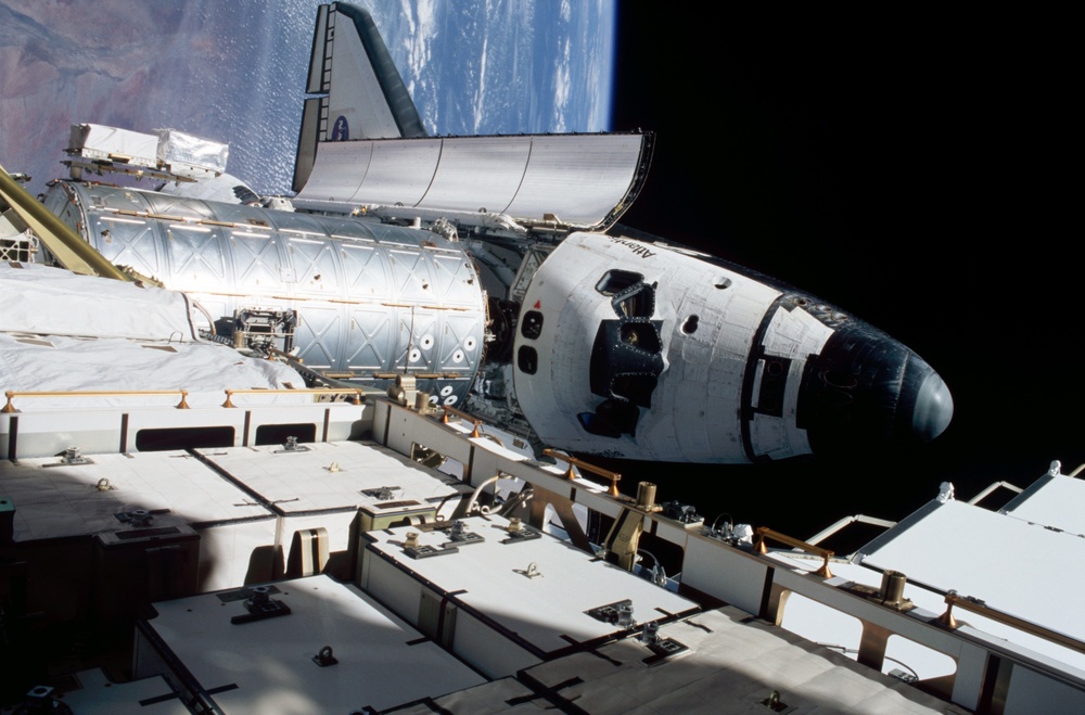 View of orbiter Atlantis and Destiny lab from P6 truss during EVA 3