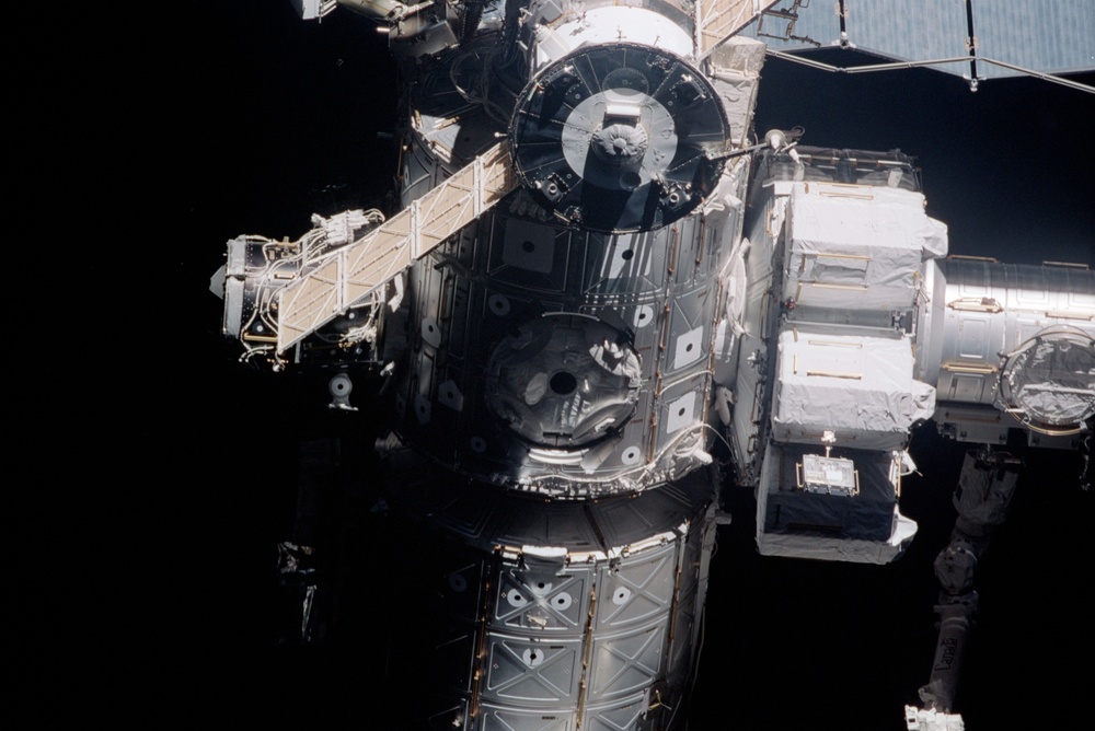 Exterior view of ISS during flyaround by STS-105 showing Node 1 and Airlock