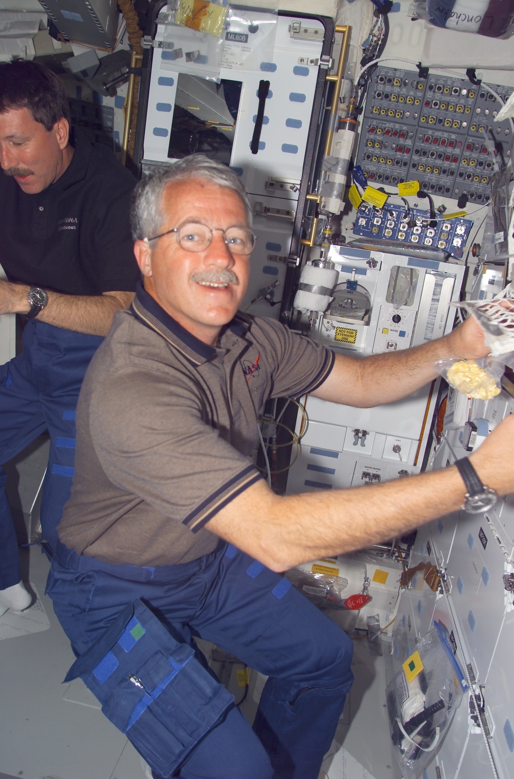 MS Phillips prepares to eat on the middeck of Endeavour
