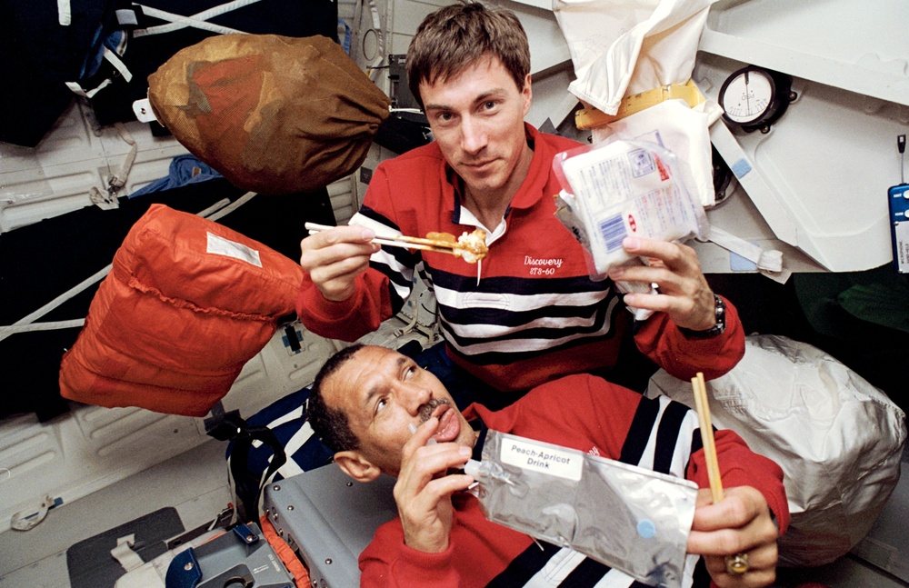 Various views of the STS-60 flight during a meal on the middeck