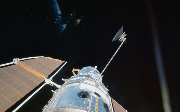 Various views during the deployment of the HST