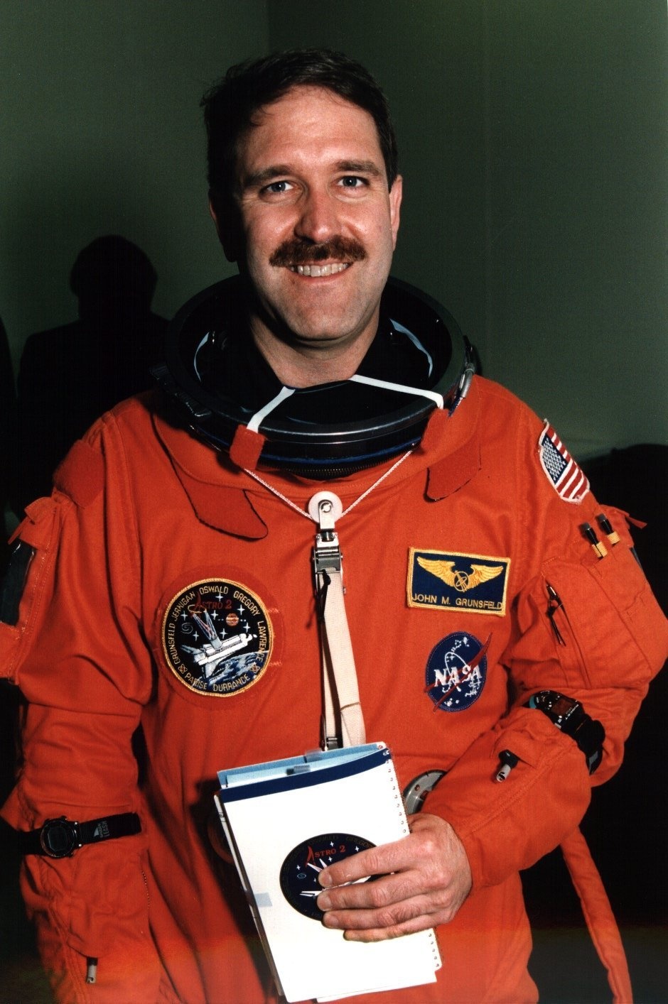 STS-67 Mission Specialist John Grunsfeld Suits Up