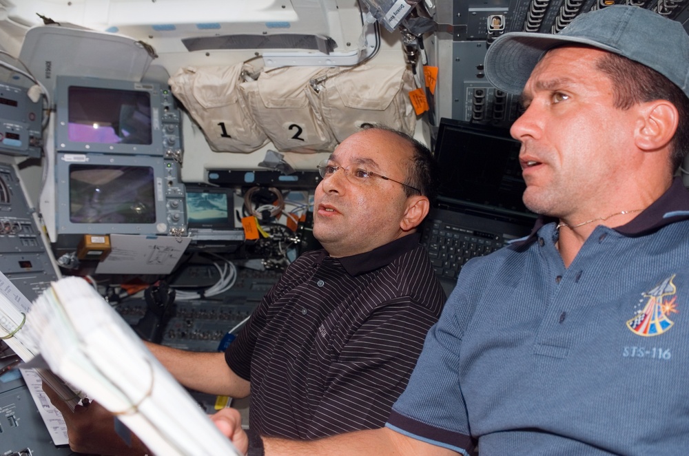 DVIDS - Images - STS-116 crewmembers Polansky and Oefelin look over ...