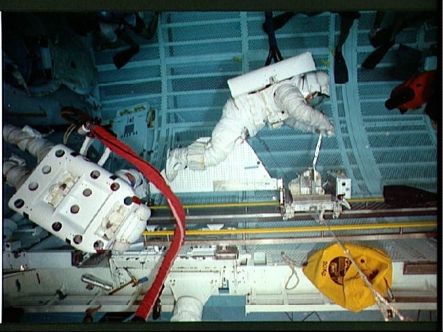 STS-37 crewmembers with CETA mechanical cart during simulation in JSC's WETF