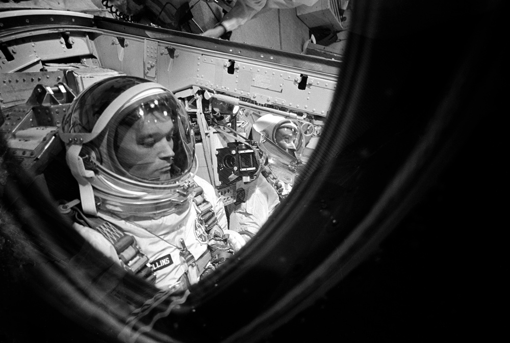 Closeup of Astronaut Collins making final checks on spacecraft before launch