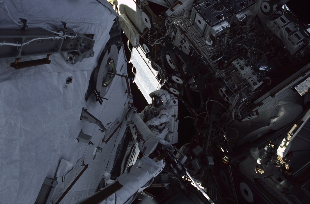 MS Ross works on the aft port struts for the S0 Truss during the second EVA of STS-110