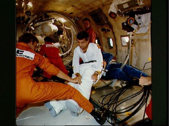 Spacsuit donning and doffing in zero-g training for Don Peterson STS-6
