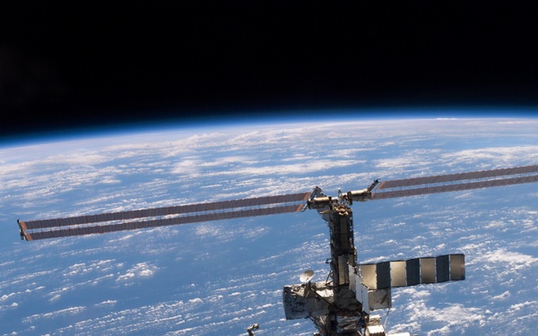 Aft - zenith view of the ISS taken during STS-110's undocking and final flyaround