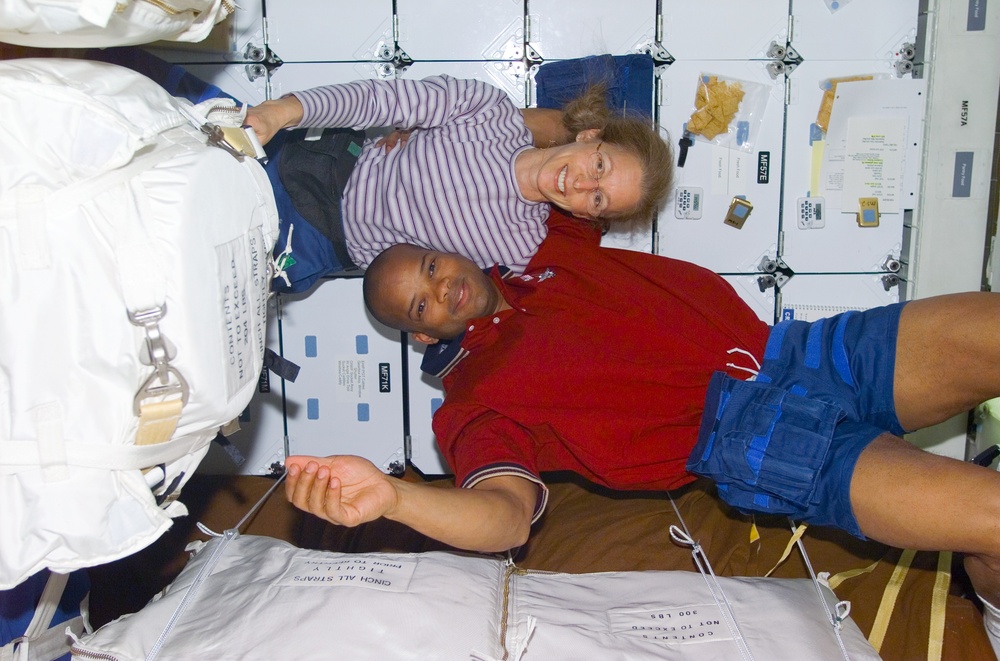MS Ivins and Curbeam on middeck with stowage bags