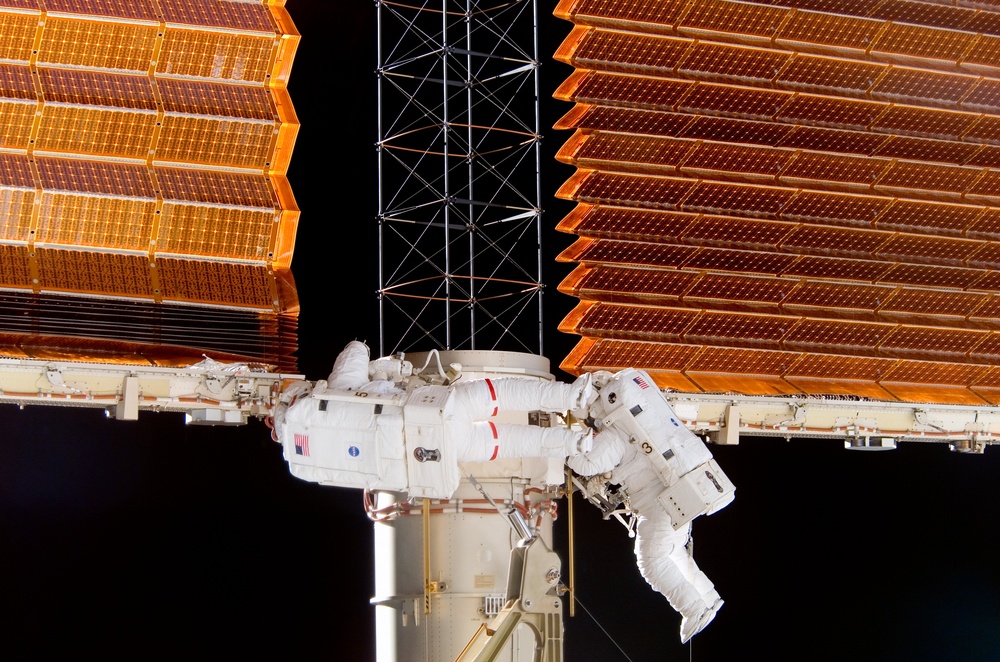 STS-116 Crewmembers Curbeam and Williams works on P6 Truss during EVA 3