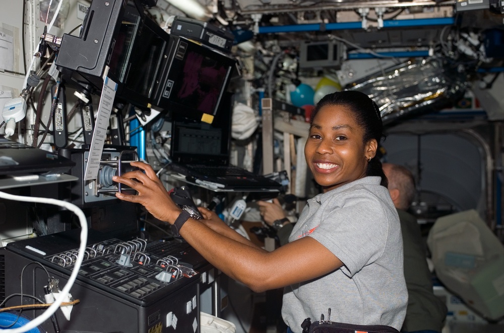 Wilson works at the SSRMS during STS-121 / Expedition 13 joint operations