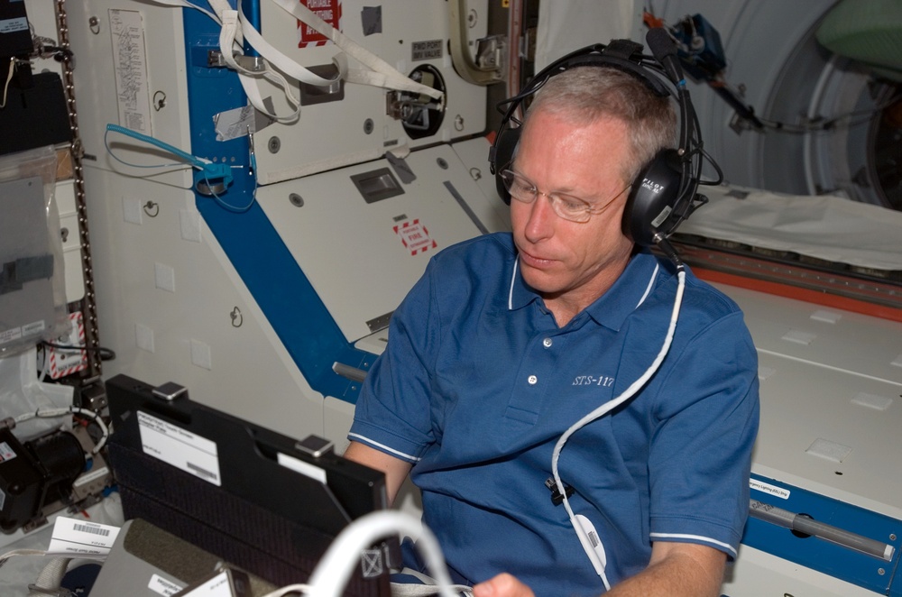 Forrester works with the TRAC Experiment in the U.S Laboratory during Joint Operations