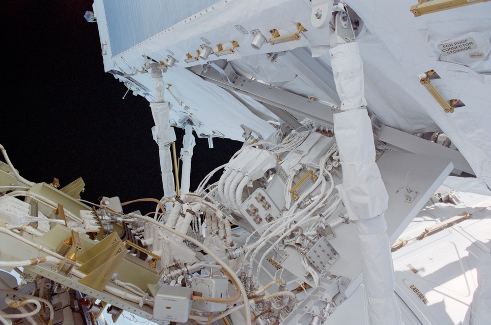 View of the aft avionics tray between the Z1 and S0 Trusses taken during the fourth EVA of STS-110