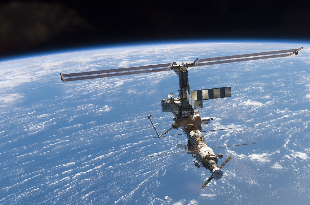 Aft - zenith view of the ISS taken during STS-110's undocking and final flyaround