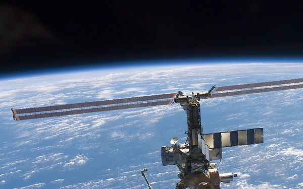 Aft - zenith view of the ISS taken during STS-110's undocking and final flyaround