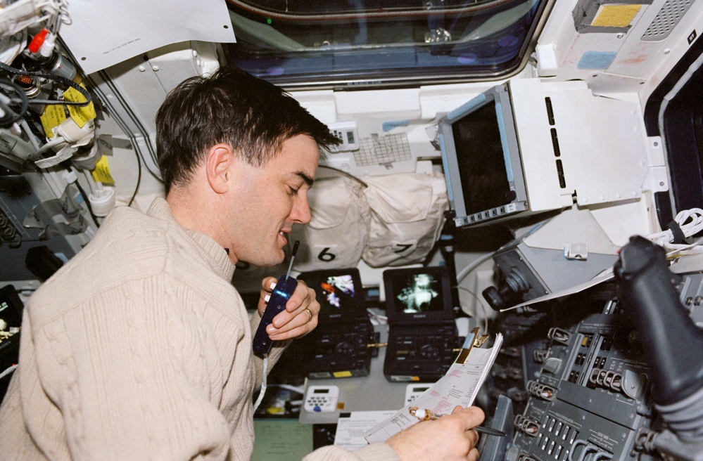 MS Walheim works on the flight deck during the fourth EVA of STS-110