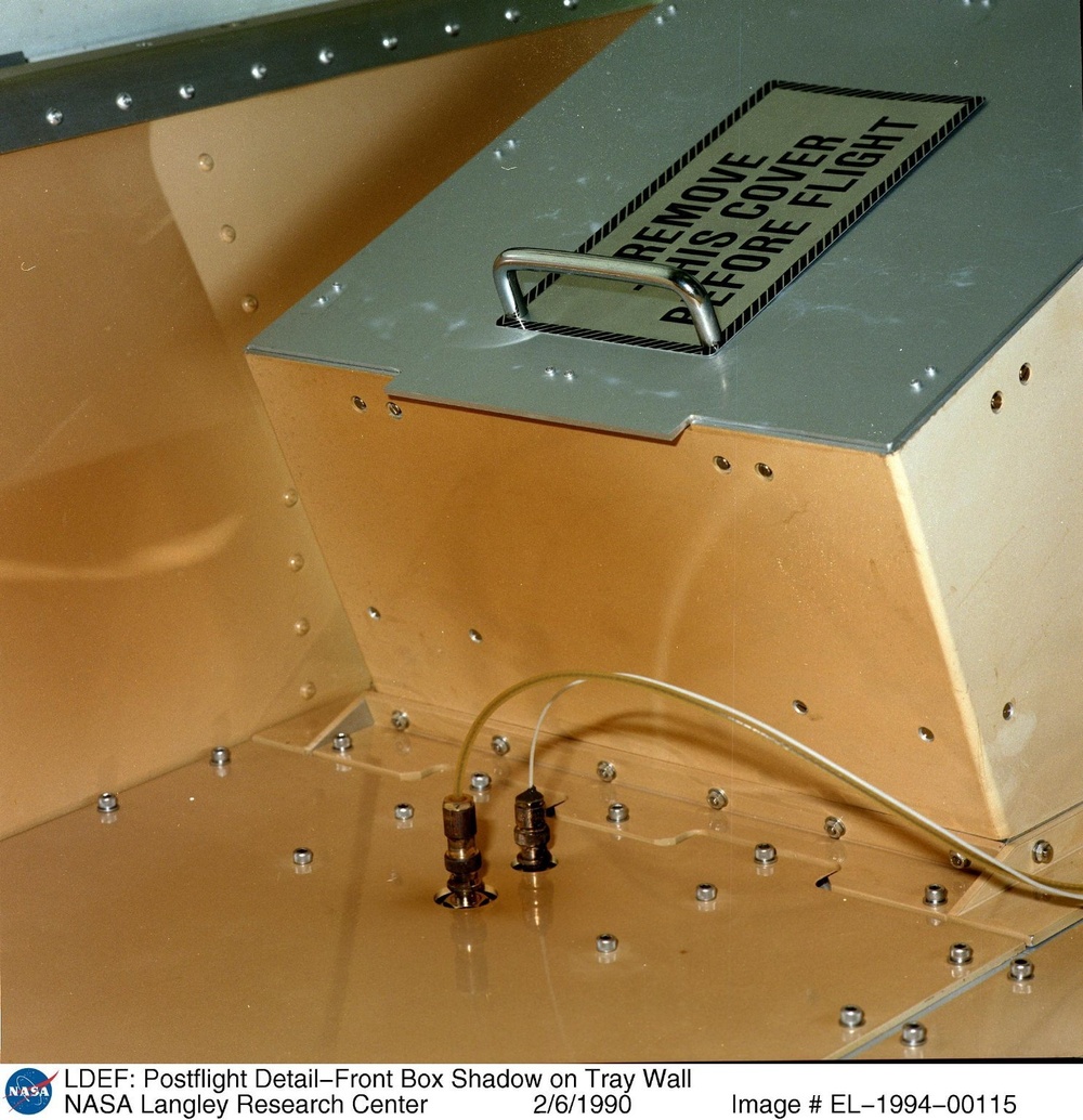 LDEF: Postflight Detail-Front Box Shadow on Tray Wall