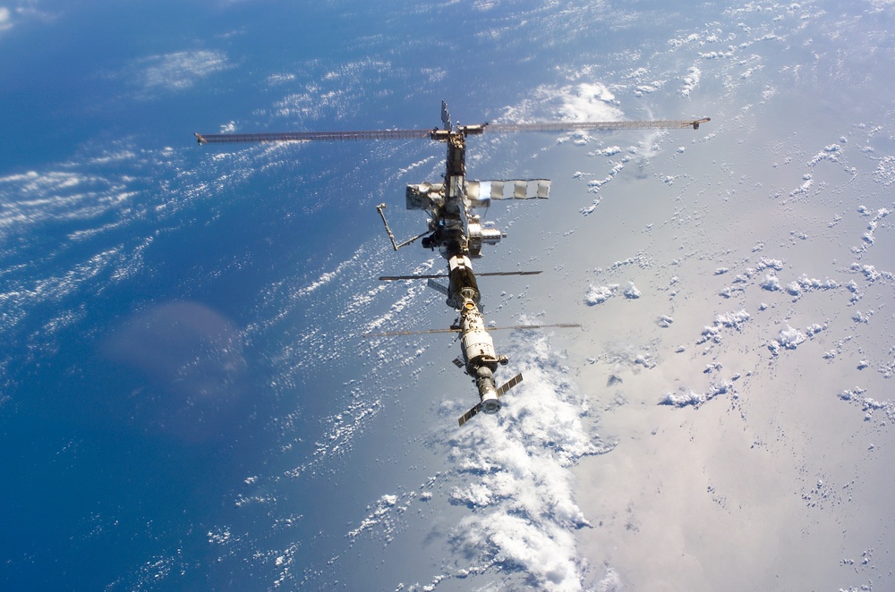 Aft - zenith view of the ISS taken during STS-110's undocking and final flyaround