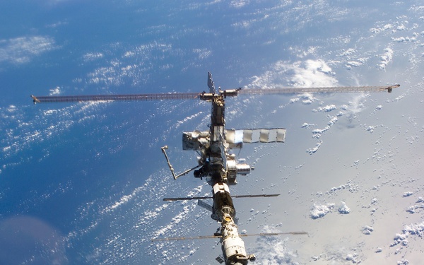 Aft - zenith view of the ISS taken during STS-110's undocking and final flyaround