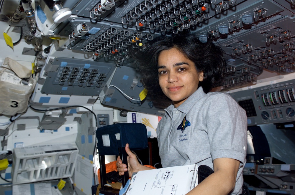 Chawla smiles from the AFD of Columbia during STS-107