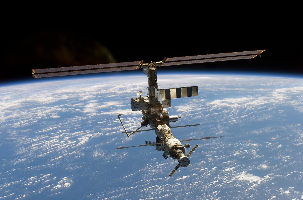 Aft - zenith view of the ISS taken during STS-110's undocking and final flyaround