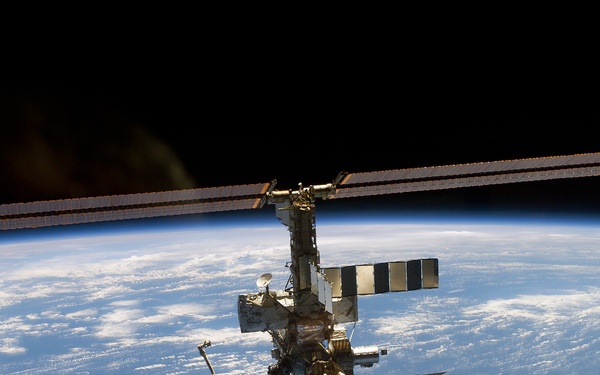 Aft - zenith view of the ISS taken during STS-110's undocking and final flyaround