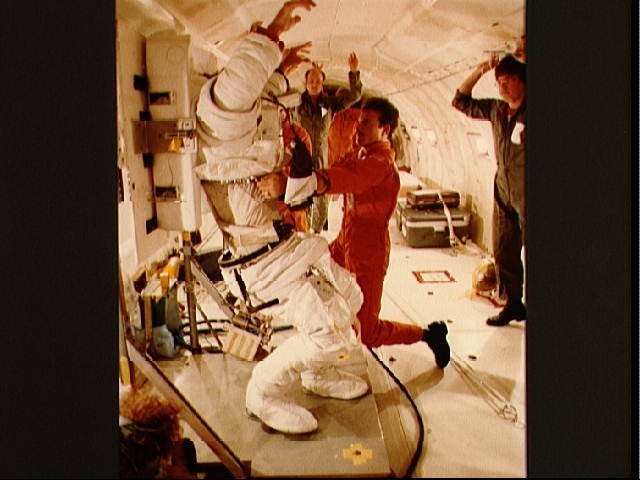 41-D crewmembers participate in suiting exercise in KC-135