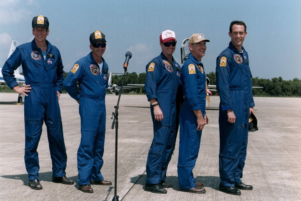 STS-69 Crew members display &quot;Dog Crew&quot; patches
