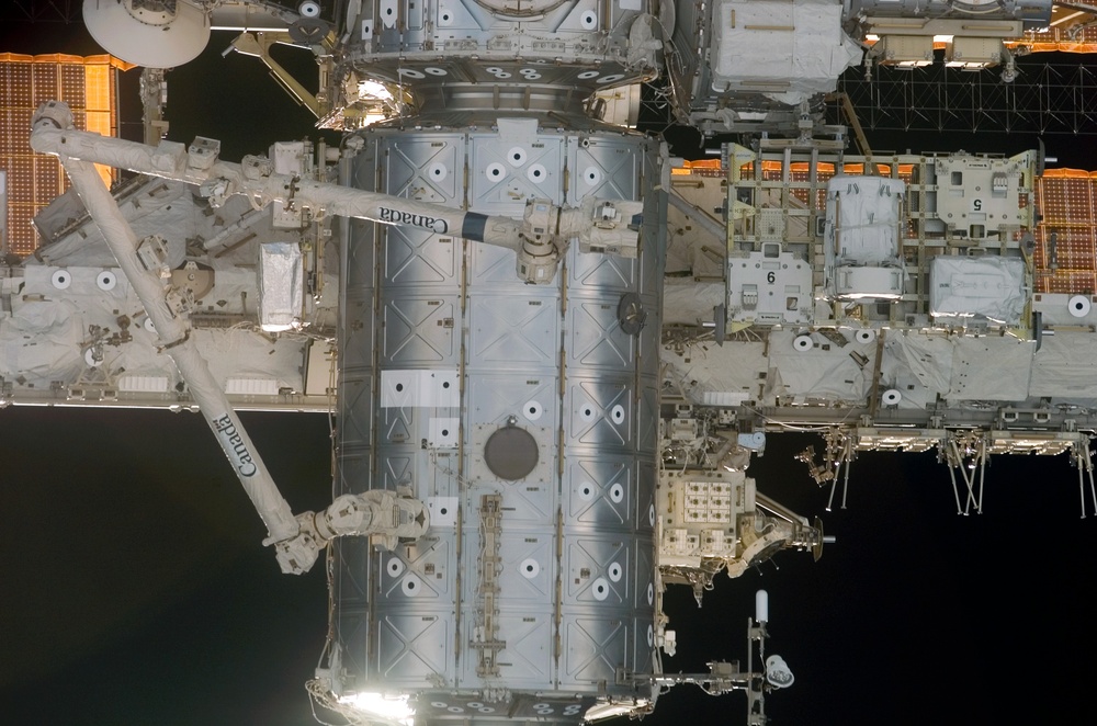 View of the U.S. Lab as the orbiter Discovery moves in for docking during STS-121