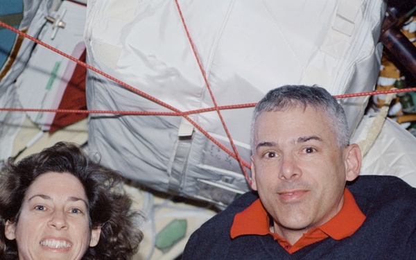 Morin and Ochoa pose in the Pirs Docking Compartment during STS-110