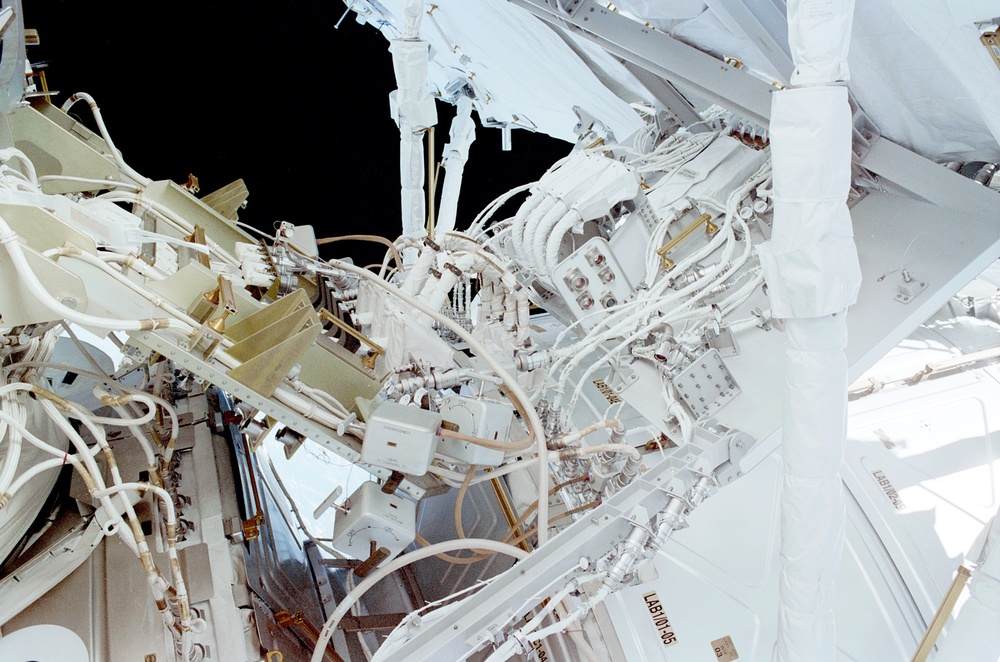 View of the aft avionics tray between the Z1 and S0 Trusses taken during the fourth EVA of STS-110