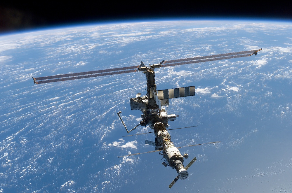 Aft - zenith view of the ISS taken during STS-110's undocking and final flyaround