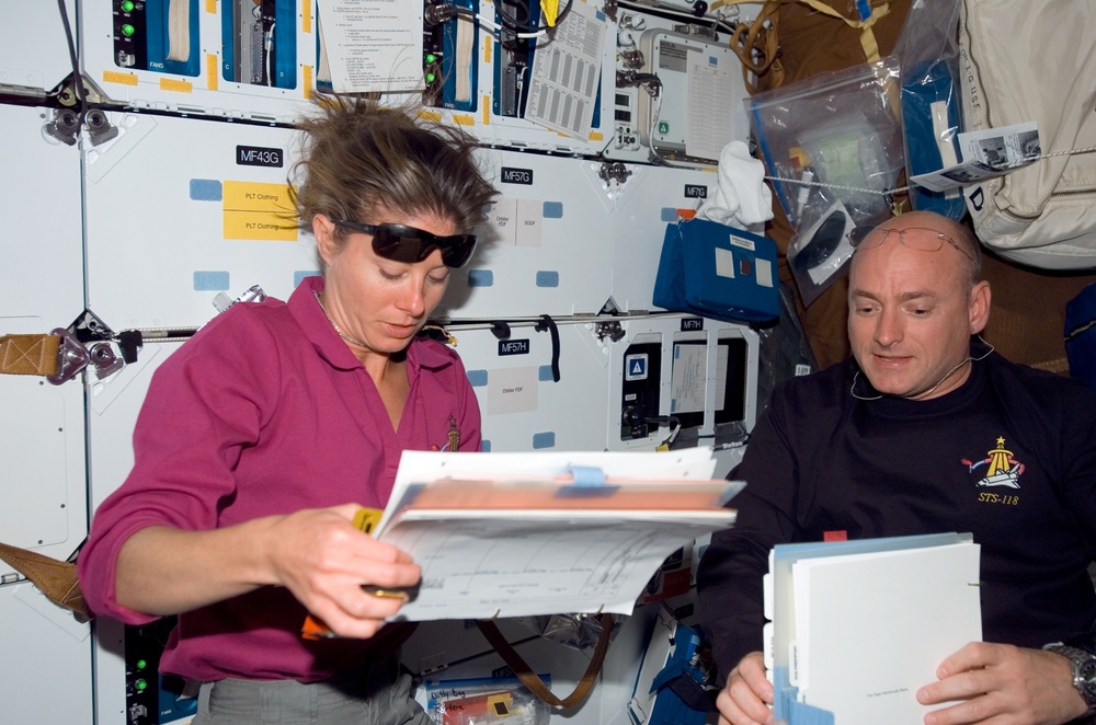 View of Kelly and Caldwell working in the MDDK during STS-118